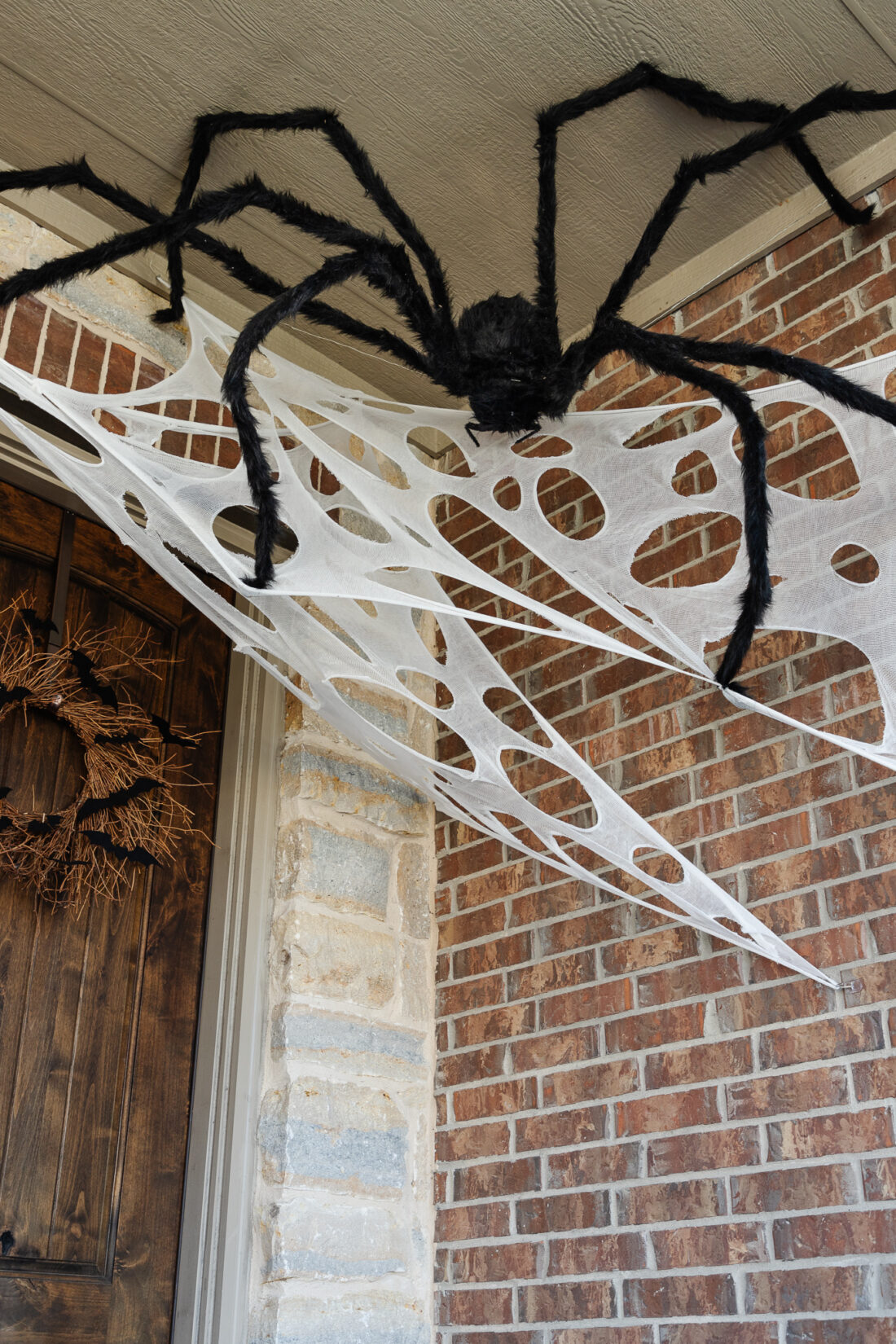 large halloween spider decoration on porch